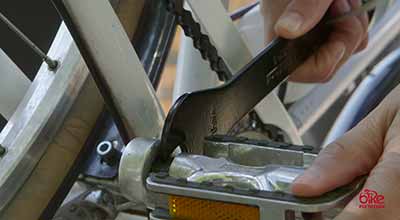 Using a pedal wrench on a bike